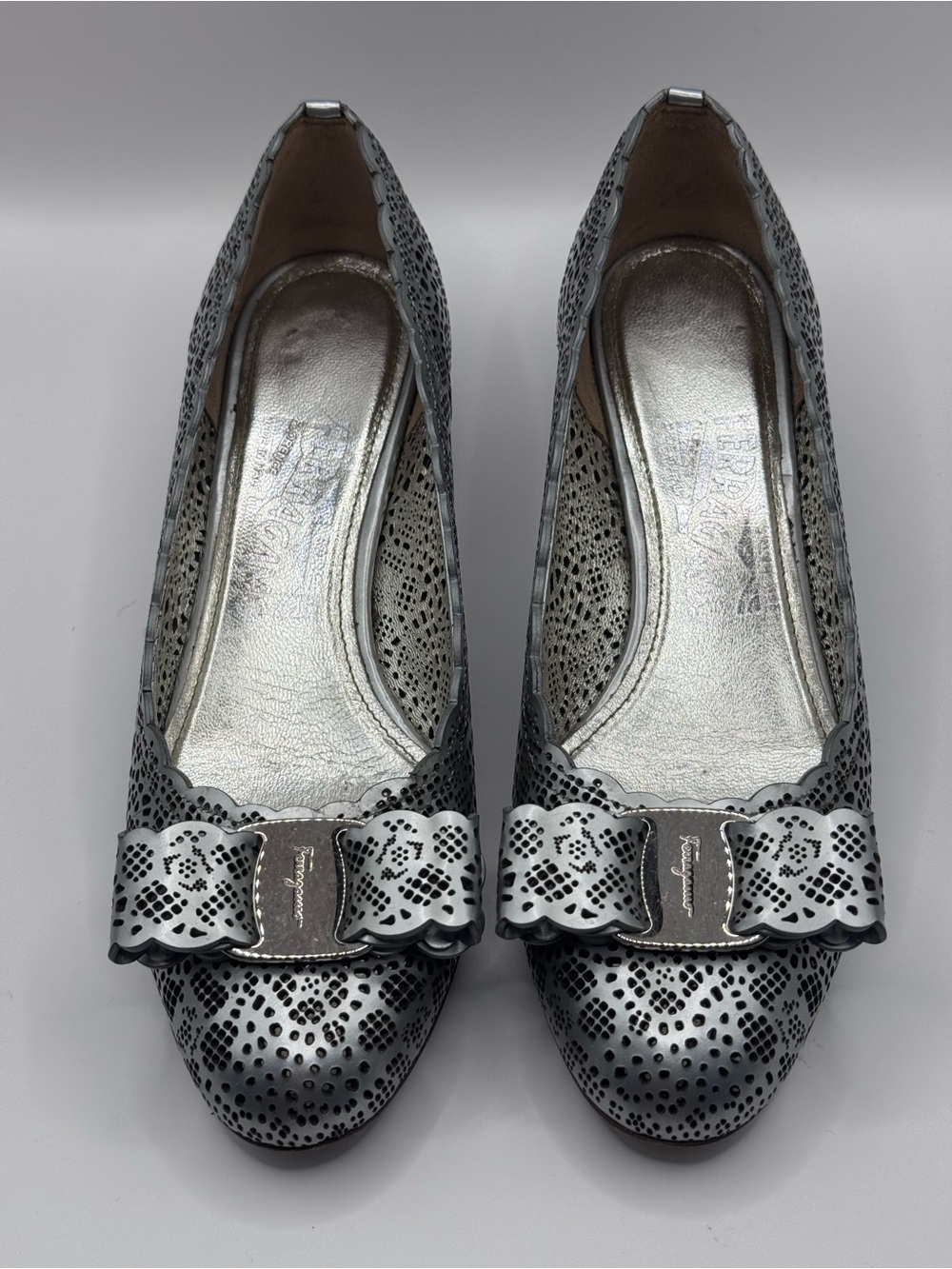 Salvatore Ferragamo Silver “Vara” Perforated Laser-Cut Bow Pumps